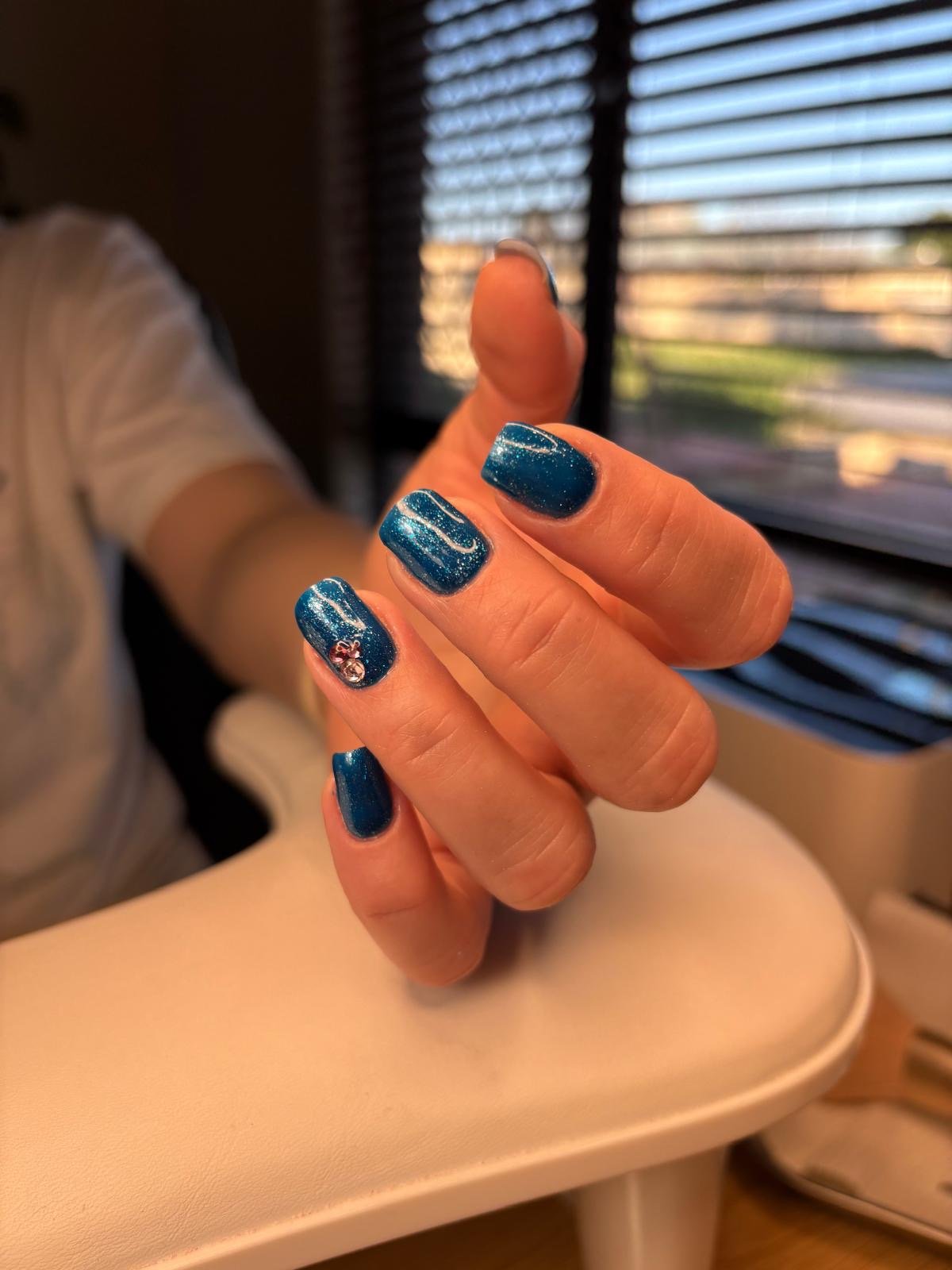 Russian manicure BIAB and colour in blue with glitter and gemstones at Queen Bee Nails in Rockingham WA