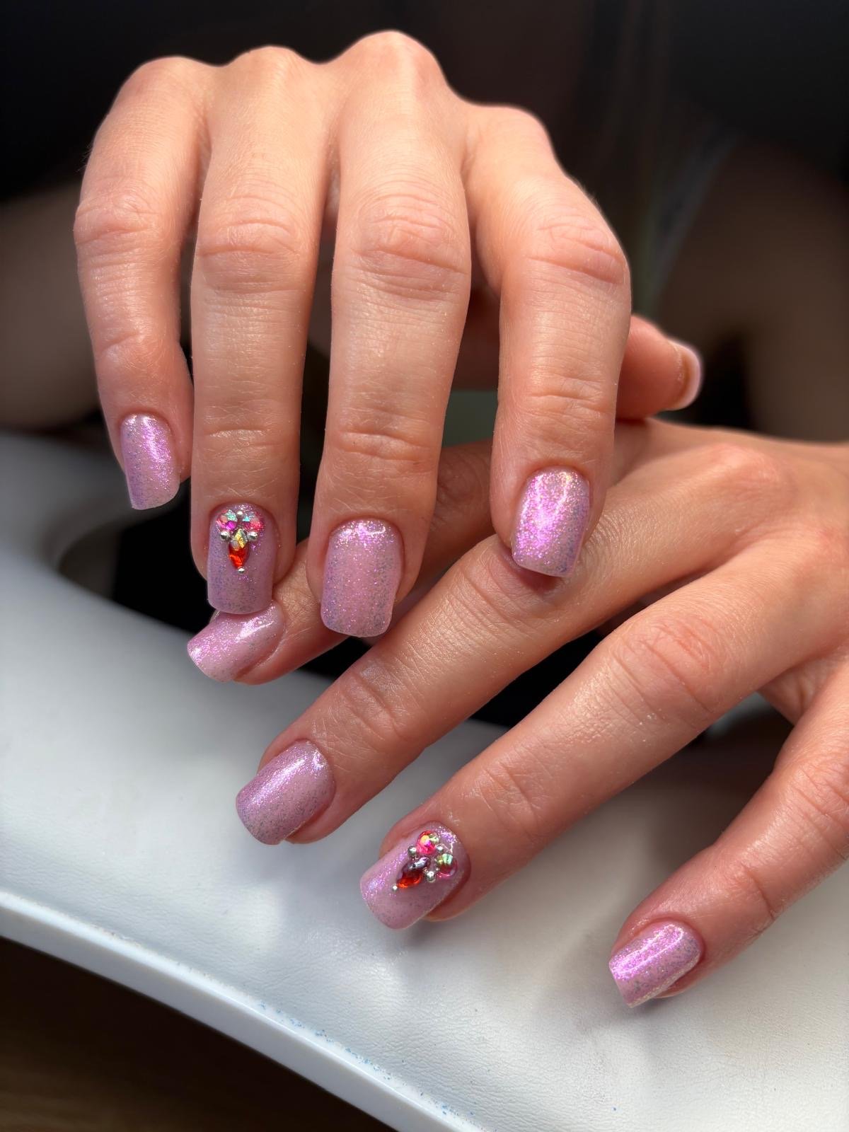 Russian manicure BIAB and colour in liquid pink with glitter and gemstones at Queen Bee Nails in Rockingham WA