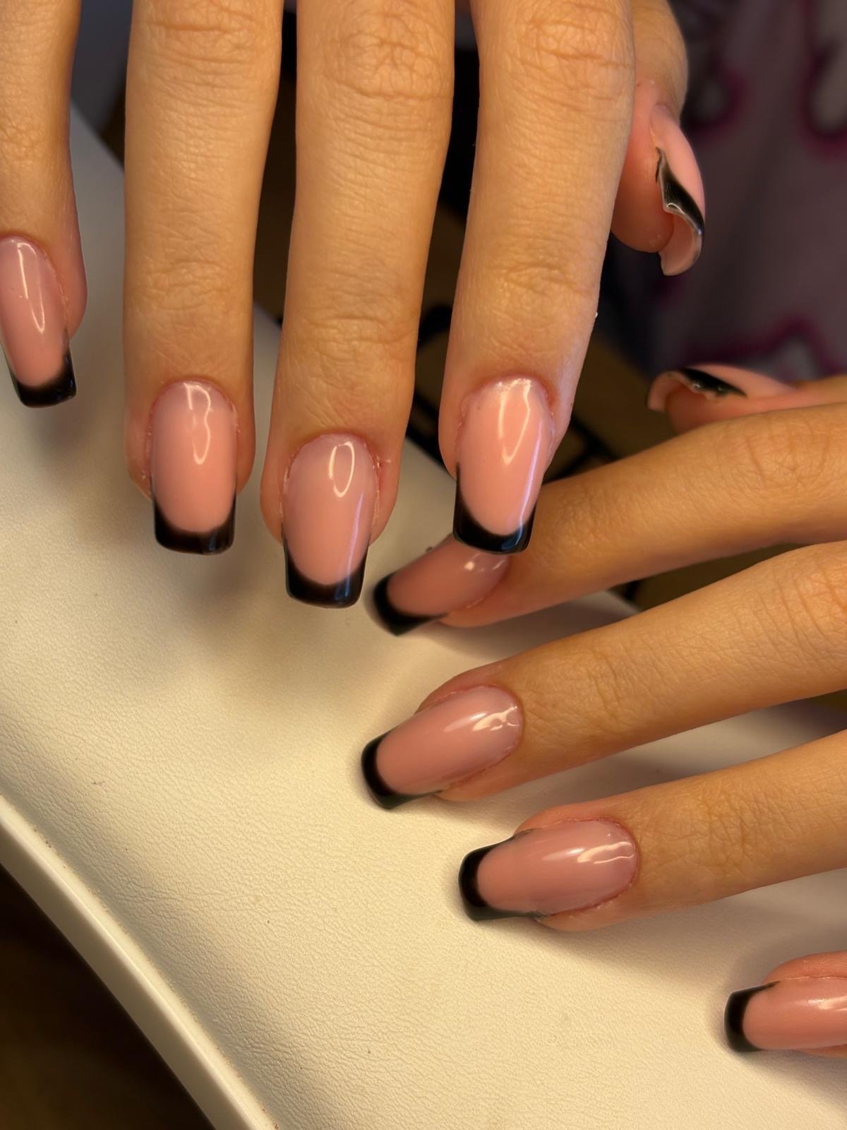 Russian manicure hard gel and colour in nude extensions with black French tips at Queen Bee Nails in Rockingham WA